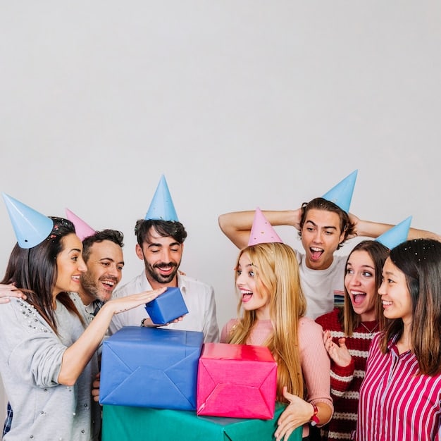Group of friends celebrating birthday with boxes